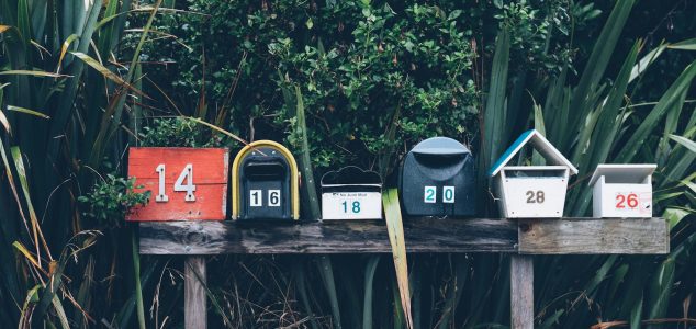 six assorted-color mail boxes